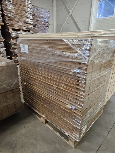 Prepared timber components inside the sauna factory